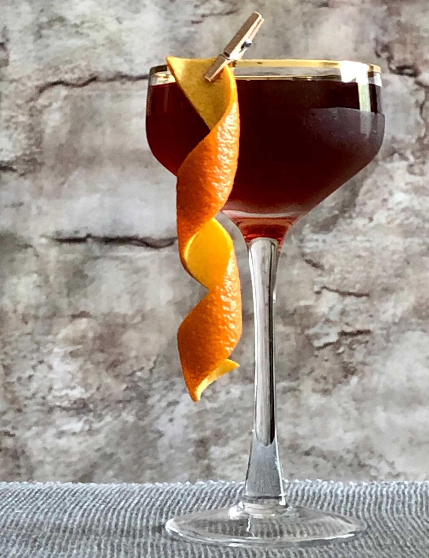 An example of the The Charleston, the mixed drink (drink) featuring bourbon whiskey, Henriques & Henriques Rainwater Madeira, Henriques & Henriques Generoso Doce 5 Year Old Madeira, Angostura bitters, and orange twist; photo by Lee Edwards