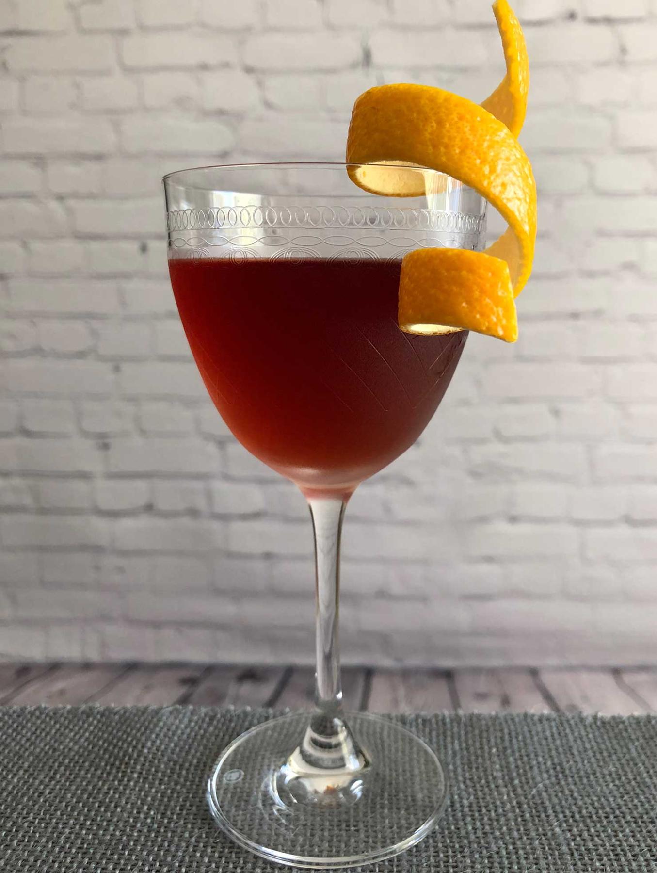 An example of the Fair Thee Well, the mixed drink (drink), by Brian Means, Fifth Floor, San Francisco, featuring bourbon whiskey, Cocchi Barolo Chinato, Pierre Ferrand Dry Curaçao, and orange twist; photo by Lee Edwards