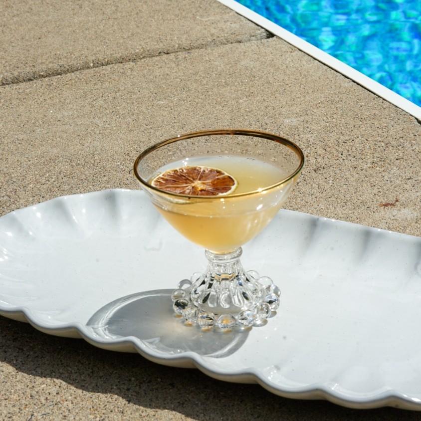 An example of the Mosquito Coast, the mixed drink (drink), by Phil Ward, NYC, featuring The Scarlet Ibis Trinidad Rum, lime juice, simple syrup, St. Elizabeth Allspice Dram, and lime wheel
