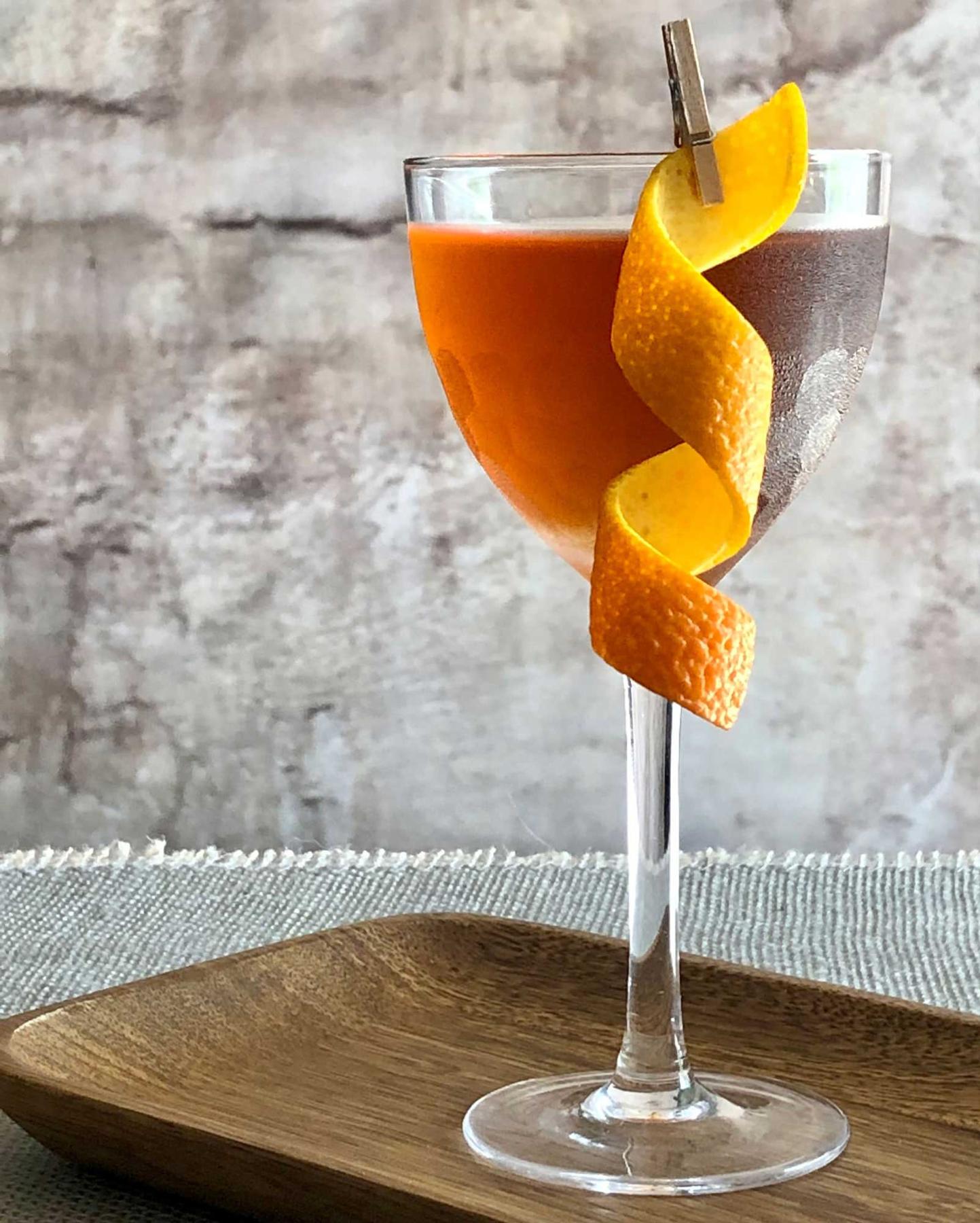 An example of the Tlaquepaque, the mixed drink (drink) featuring blanco tequila, Cocchi Vermouth di Torino ‘Storico’, orange bitters, and orange twist or grapefruit twist; photo by Lee Edwards