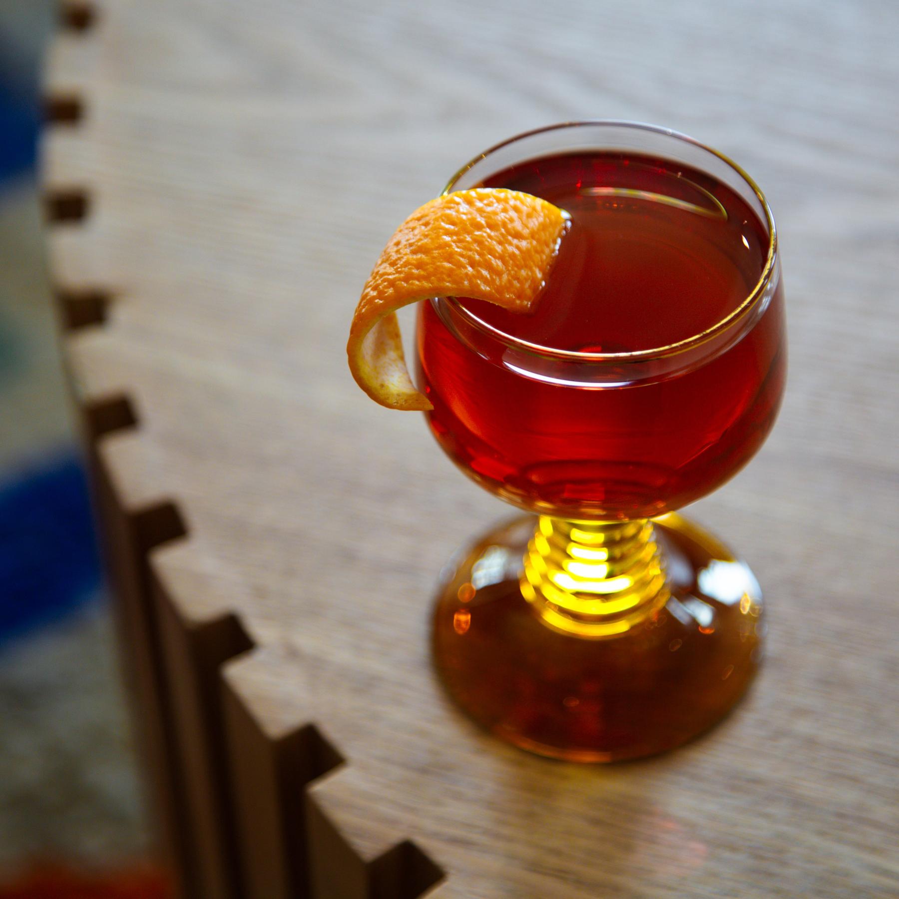 An example of the Affinity, the mixed drink (drink) featuring scotch whisky, Cocchi Dopo Teatro Vermouth Amaro, Dolin Dry Vermouth de Chambéry, and orange twist; photo by Megan Heinowski
