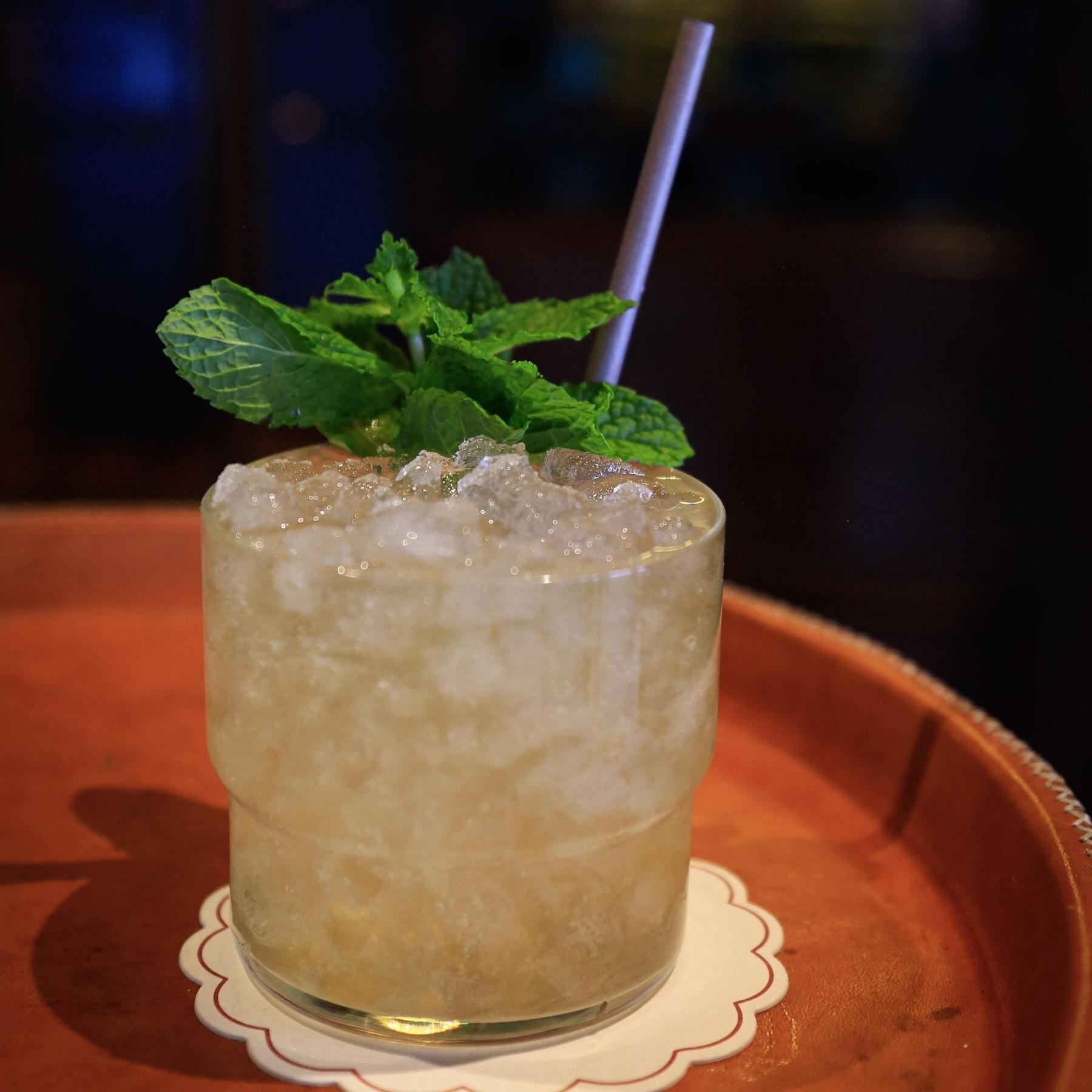 An example of the B-Side, the mixed drink (drink), Adapted from a recipe by Gracy Ramirez, Los Angeles, CA, featuring fino sherry, soda water, Menthe Verte Spearmint Liqueur, Hayman’s Old Tom Gin, and lemon juice; photo by Megan Heinowski