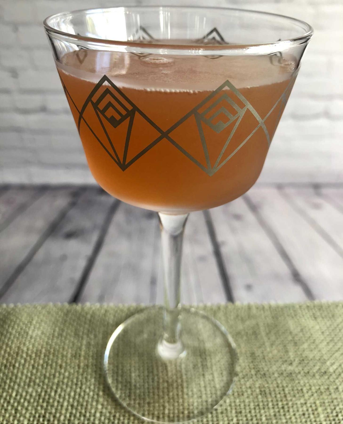 An example of the Demeter, the mixed drink (drink), adapted from the Persephone, PDT Cocktail Book, featuring applejack, Dolin Rouge Vermouth de Chambéry, Hayman’s Sloe Gin, lemon juice, and simple syrup; photo by Lee Edwards