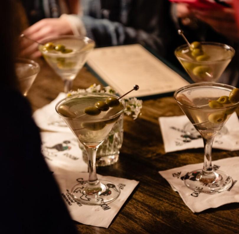 An example of the Hayroller, the mixed drink (drink), by Anne-Claire Brewer, featuring Alpeggio Hay Liqueur, manzanilla, and olive; photo by Lisa Hause