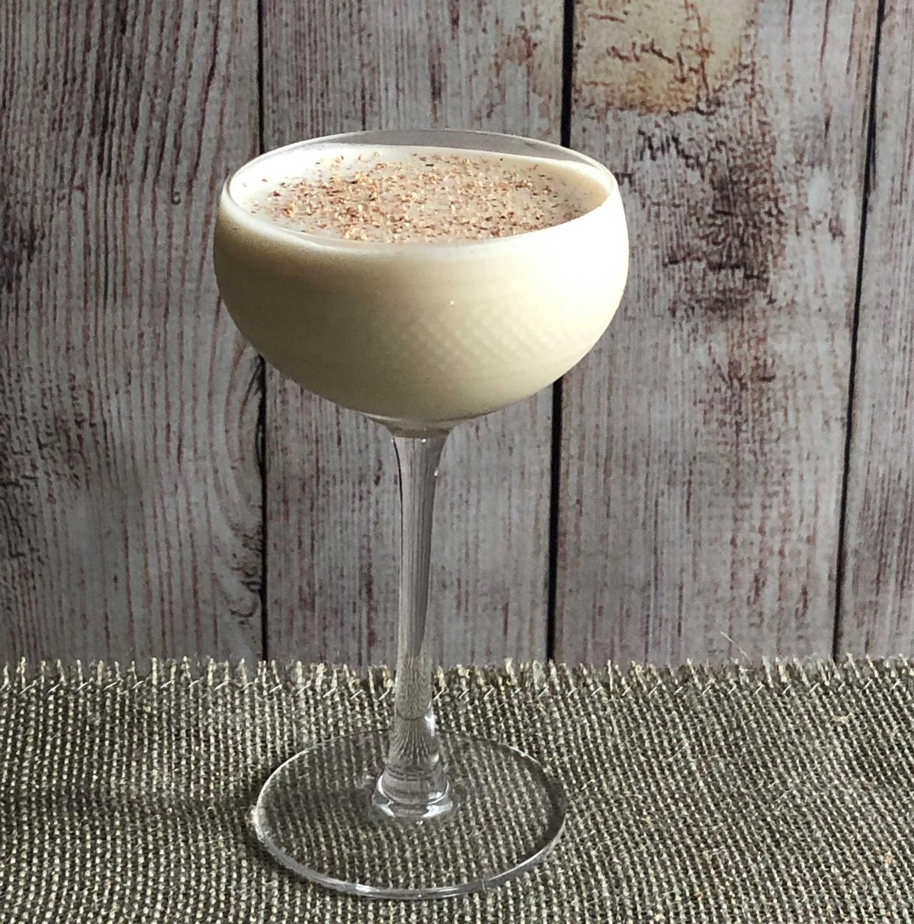 An example of the Génépy Suisse, the mixed drink (drink), by Ryan Maybee, Manifesto, Kansas City, Missouri, featuring Dolin Génépy le Chamois Liqueur, crème de cacao (white), coffee-flavored liqueur, cream, absinthe, and grated nutmeg; photo by Lee Edwards