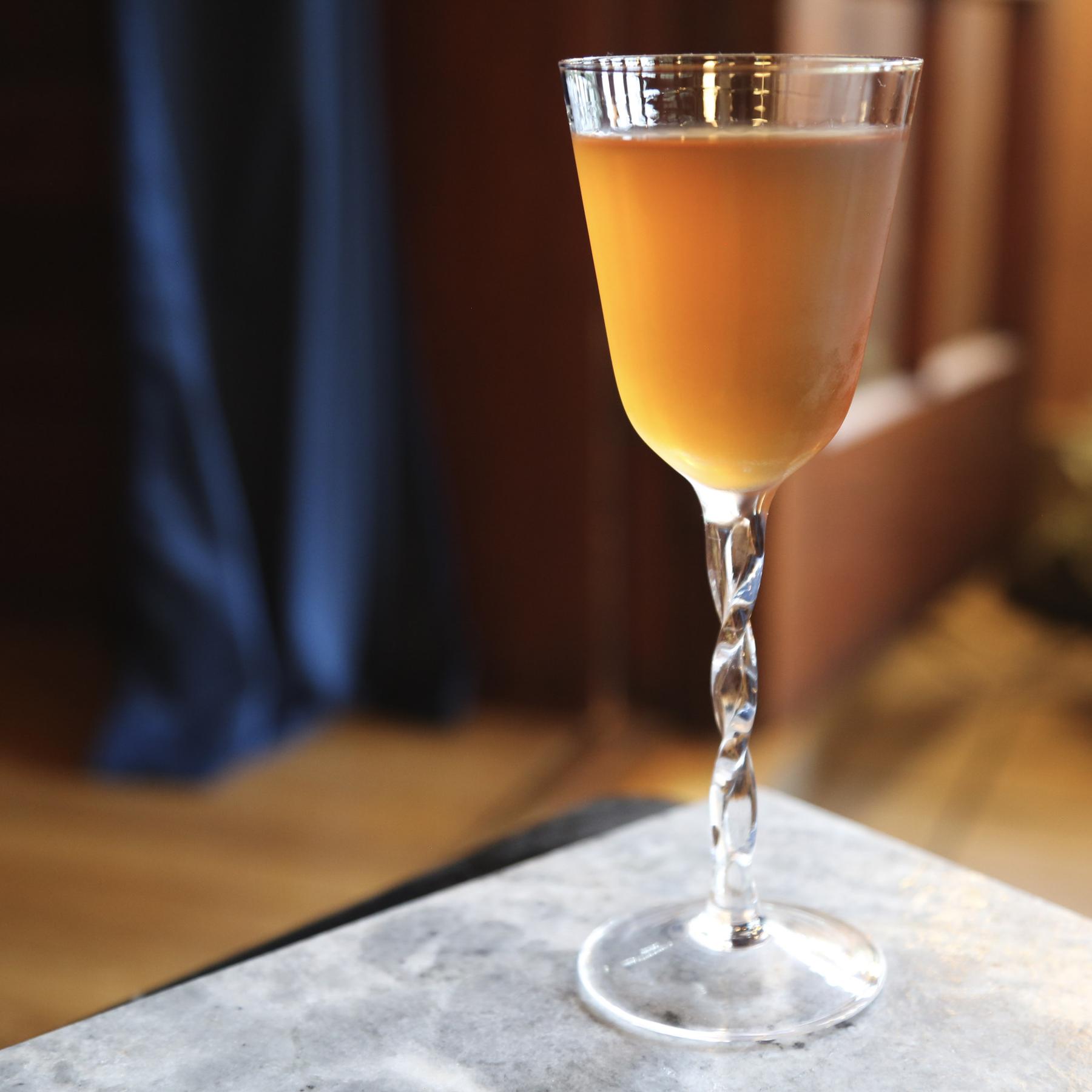 An example of the Fourrage Vert, the mixed drink (drink) featuring Purkhart Pear Williams Eau-de-Vie, Alpeggio Hay Liqueur, and cognac; photo by Megan Heinowski
