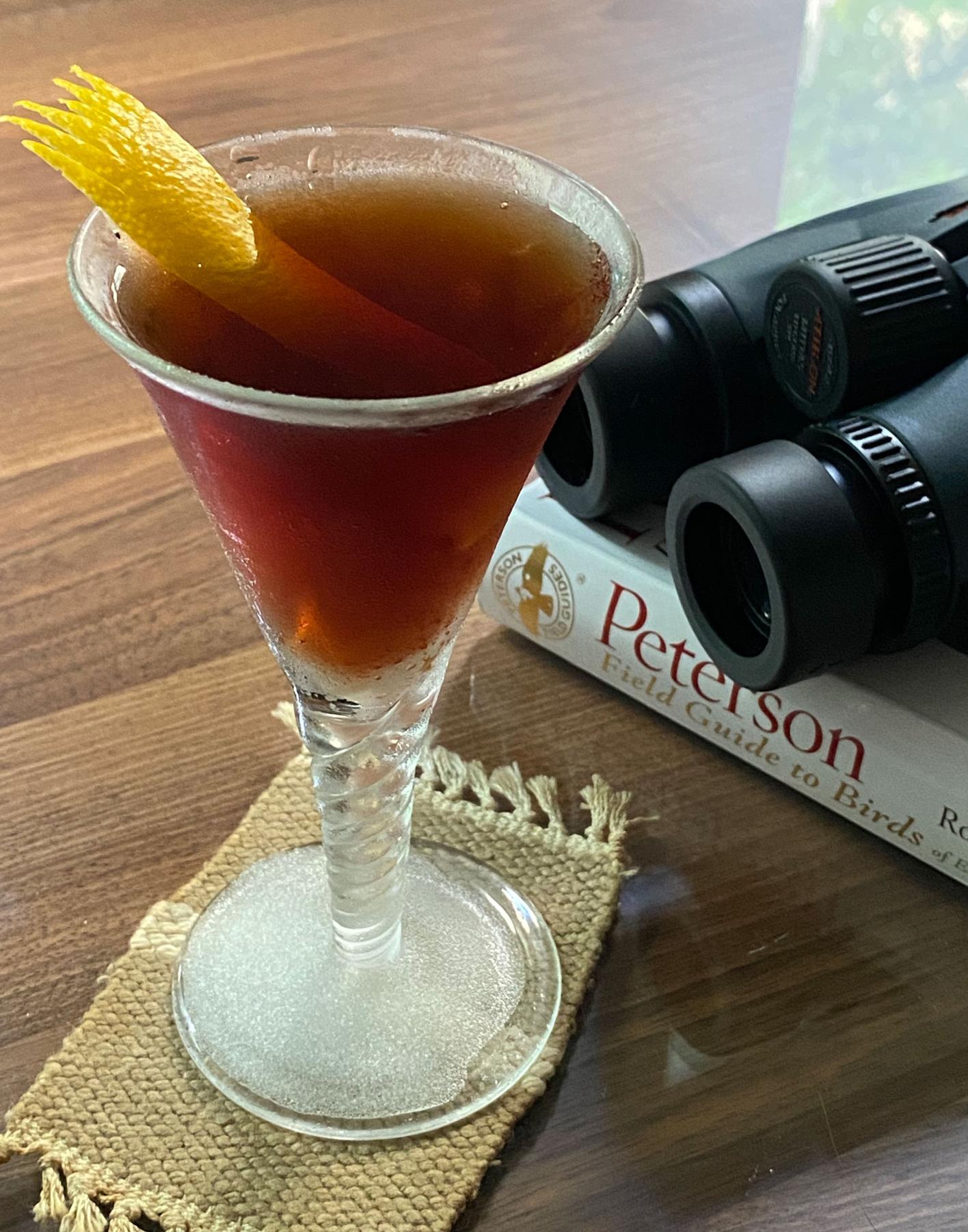 An example of the Lower Heights, the mixed drink (drink) featuring Cardamaro Vino Amaro, Pasubio Vino Amaro, Angostura bitters, and orange twist; photo by Martin Doudoroff