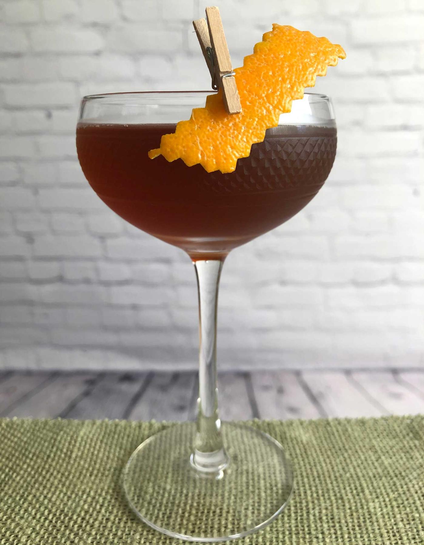 An example of the Scalatore, the mixed drink (drink) featuring bourbon whiskey, Pasubio Vino Amaro, Dolin Rouge Vermouth de Chambéry, and orange twist; photo by Lee Edwards