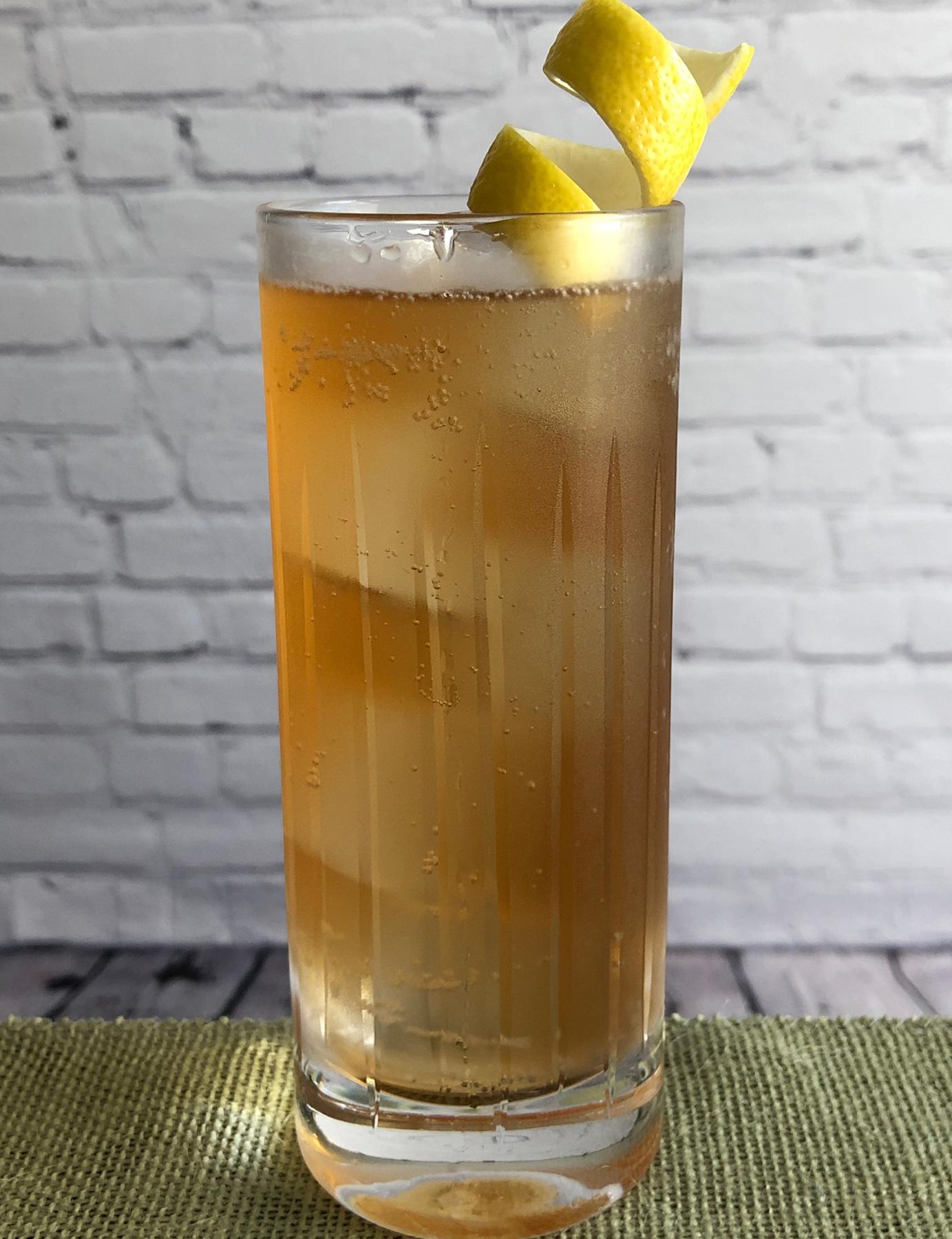 An example of the Shikoku, the mixed drink (drink), by Charles Coykendall, Benedetto, Cambridge, MA, featuring soda water, japanese whisky, Mattei Cap Corse Rouge Quinquina, and lemon twist; photo by Lee Edwards