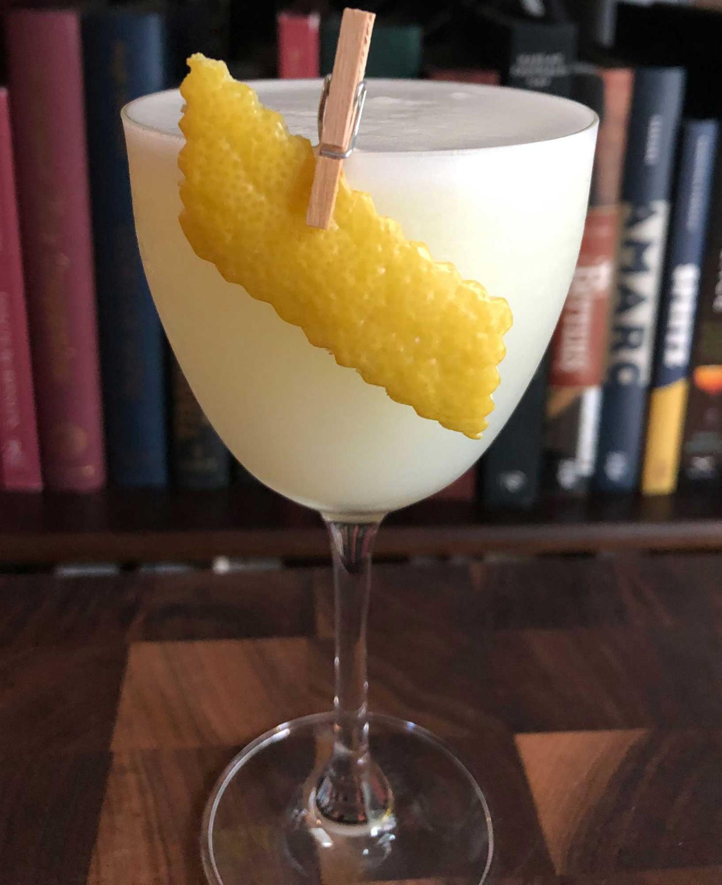 An example of the White Lady, the mixed drink (drink) featuring Hayman’s London Dry Gin, egg white, orange-flavored liqueur, lemon juice, and lemon twist; photo by Lee Edwards