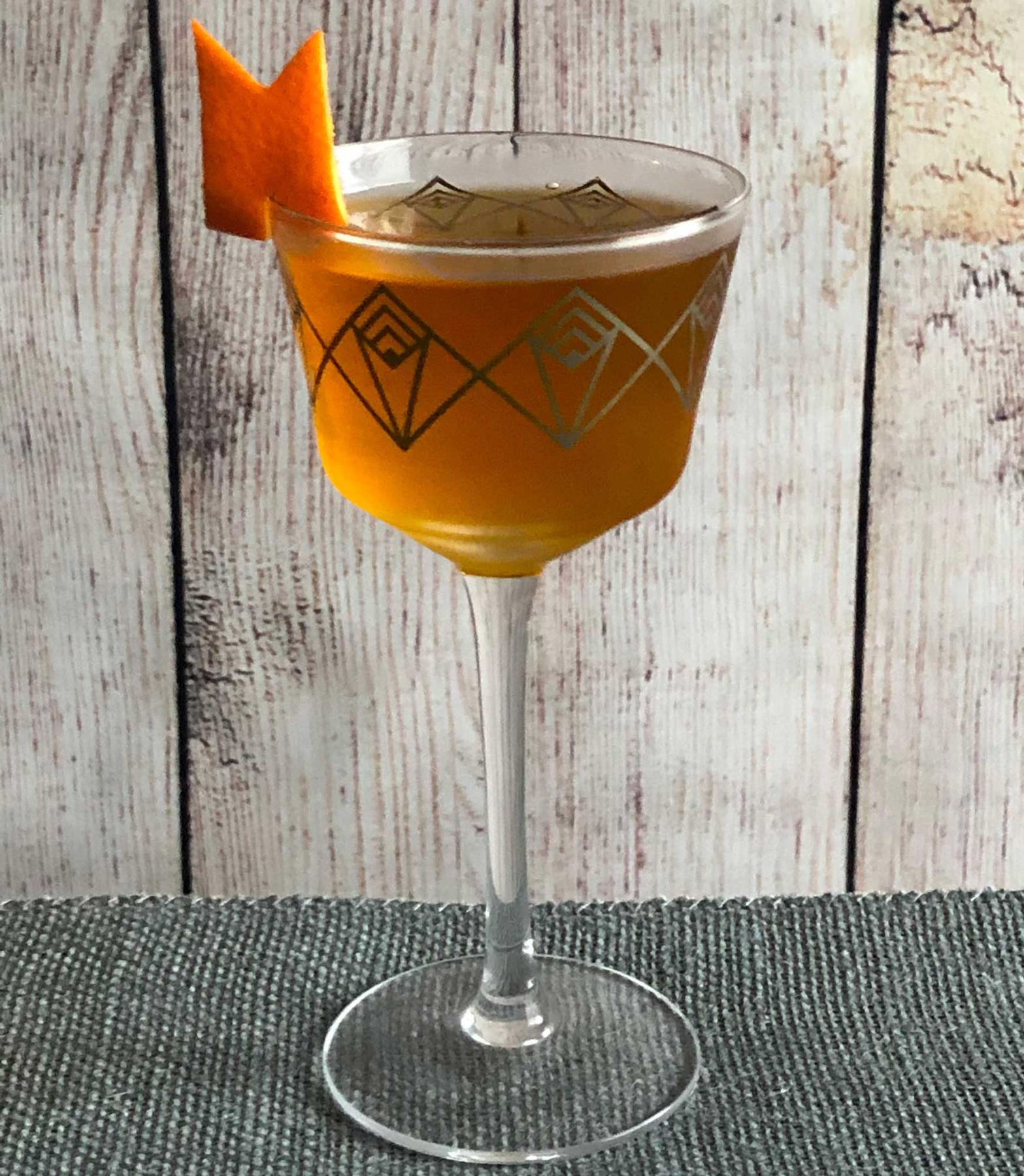 An example of the Accidental Cocktail, the mixed drink (drink), adapted from the Occidental, PDT, New York City, featuring Batavia Arrack van Oosten, orange-flavored liqueur, Cardamaro Vino Amaro, Elisir Novasalus, kosher salt, and orange twist; photo by Lee Edwards
