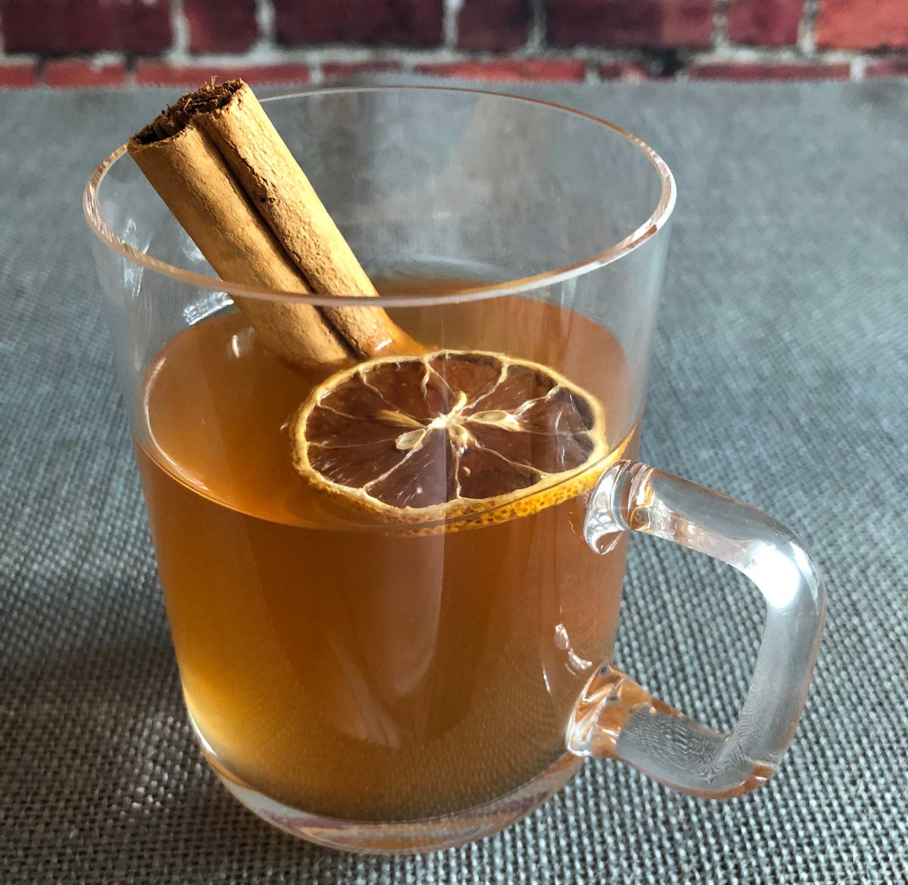 An example of the Flurries on East Bay Street, the mixed drink (drink) featuring hot water, Henriques & Henriques Generoso Doce 5 Year Old Madeira, bourbon whiskey, lemon juice, sugar, and cinnamon stick; photo by Lee Edwards