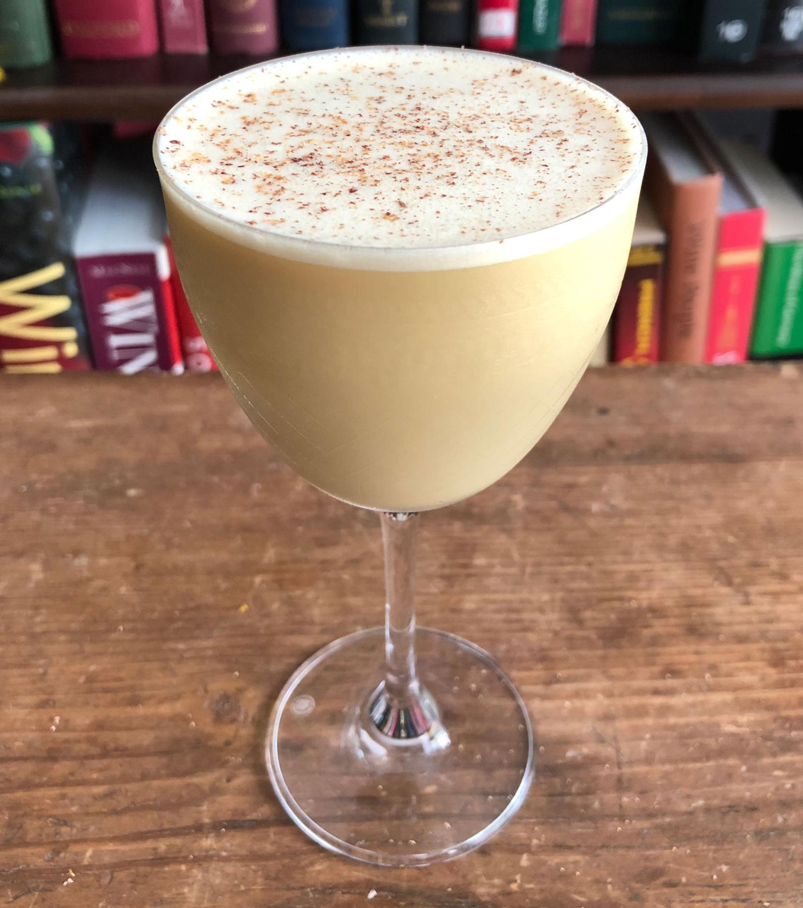 An example of the Flip It and Reverse It, the mixed drink (drink) featuring Saveiro ‘Vento do Oeste’ Madeira, raw egg, half & half, maple syrup, and grated nutmeg; photo by Lee Edwards