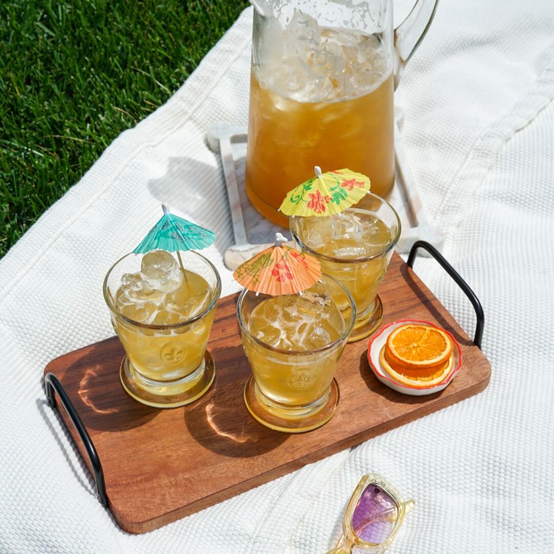 An example of the Beer Sangria, the mixed drink (batch), Adapted from a drink at Trina’s Starlite Lounge, Cambridge, MA, featuring white beer, orange juice, apple brandy, Timbal Vermut de Reus Sweet Red, Rothman & Winter Orchard Apricot Liqueur, lemon juice, and simple syrup