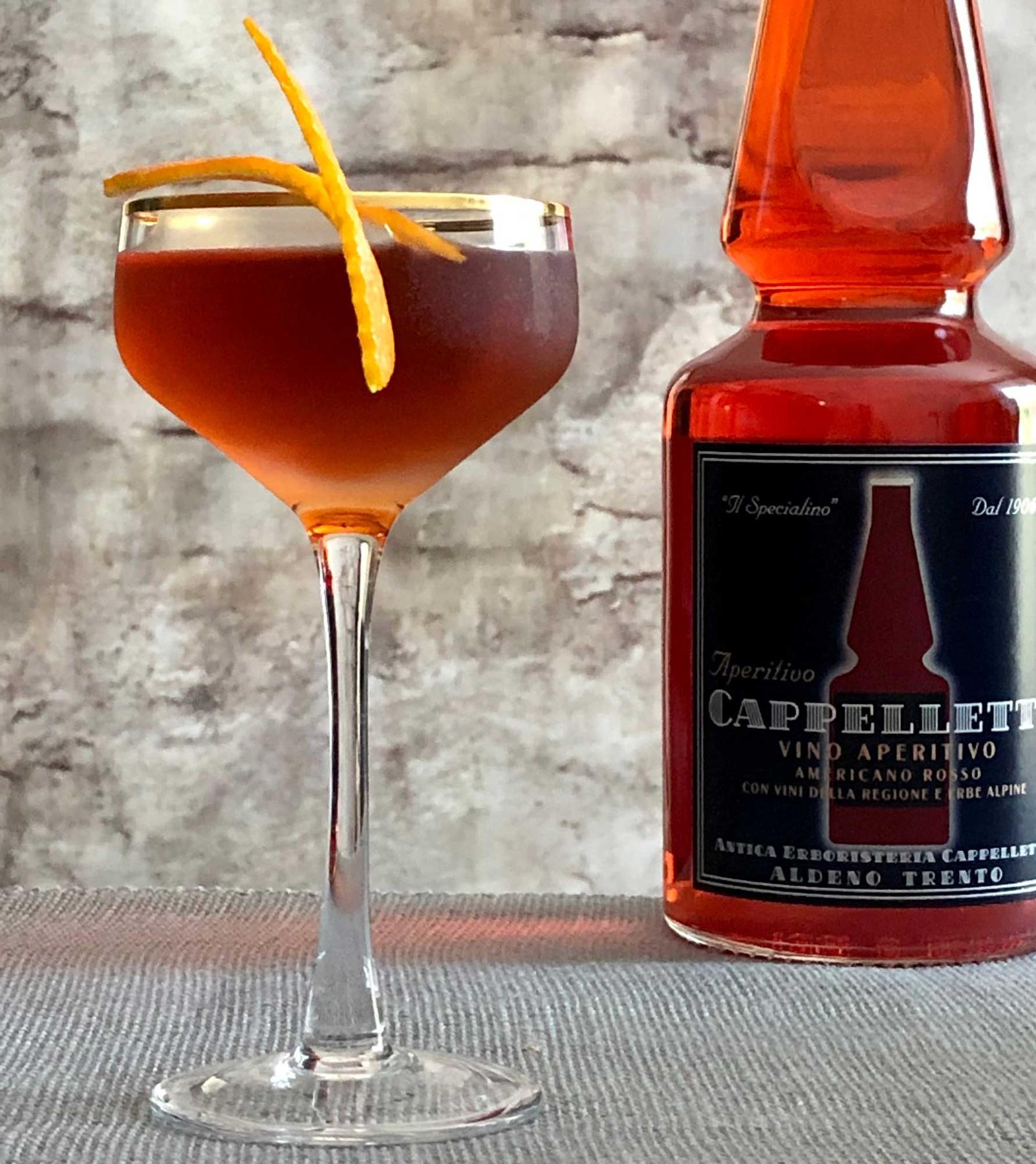 An example of the El Boulevard, the mixed drink (drink) featuring añejo tequila, Aperitivo Cappelletti, Dolin Rouge Vermouth de Chambéry, and orange twist; photo by Lee Edwards