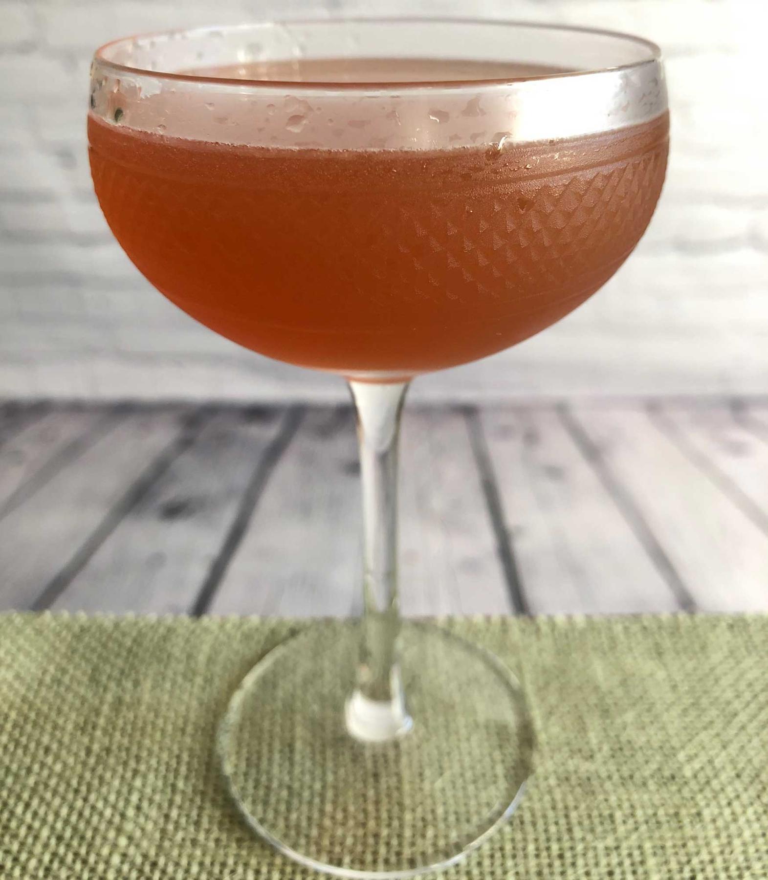An example of the Post Modern, the mixed drink (drink), by Tom Richter, Dear Irving, New York City, featuring scotch whisky, Hayman’s Sloe Gin, lemon juice, and honey syrup; photo by Lee Edwards