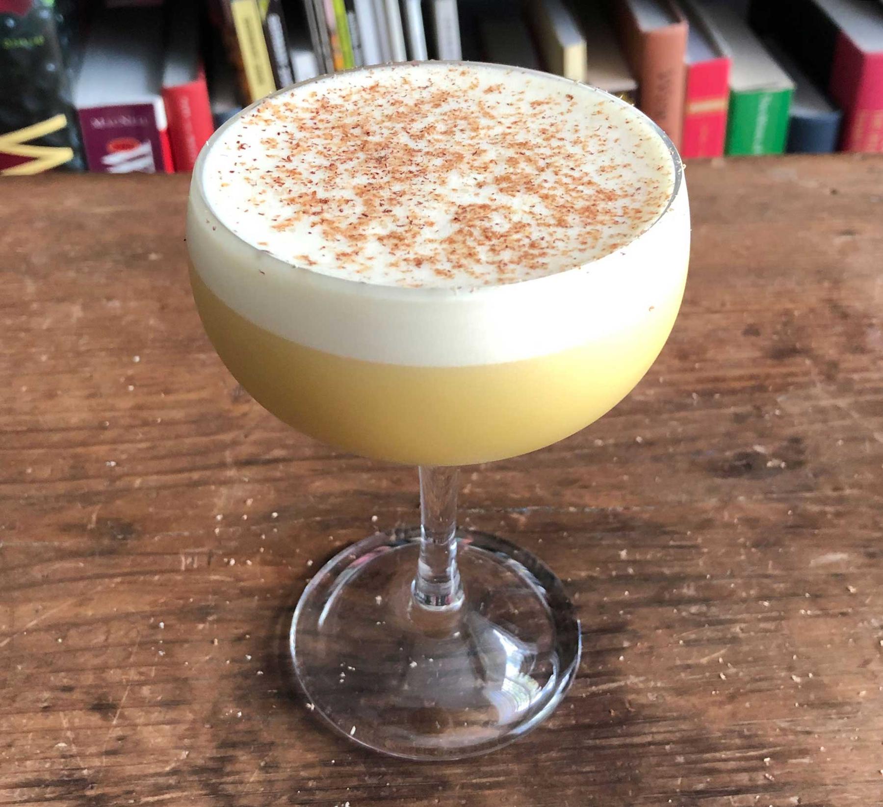 An example of the Apricot Flip, the mixed drink (drink), by John Deragon, PDT, New York City, featuring cognac, raw egg, Rothman & Winter Orchard Apricot Liqueur, simple syrup, and grated nutmeg; photo by Lee Edwards