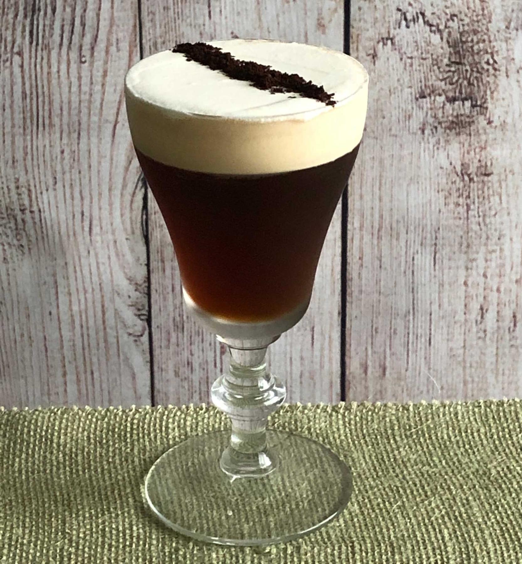 An example of the Freddo Corretto, the mixed drink (drink), by Salt Air, Venice, CA, featuring Cardamaro Vino Amaro, cold brew coffee, raw sugar syrup, Angostura bitters, whipped cream, and coffee grinds; photo by Lee Edwards