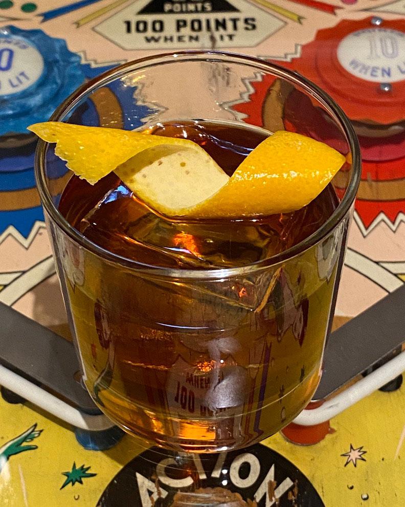 An example of the Separatist, the mixed drink (drink) featuring Cardamaro Vino Amaro, Mattei Cap Corse Rouge Quinquina, and orange twist; photo by Martin Doudoroff
