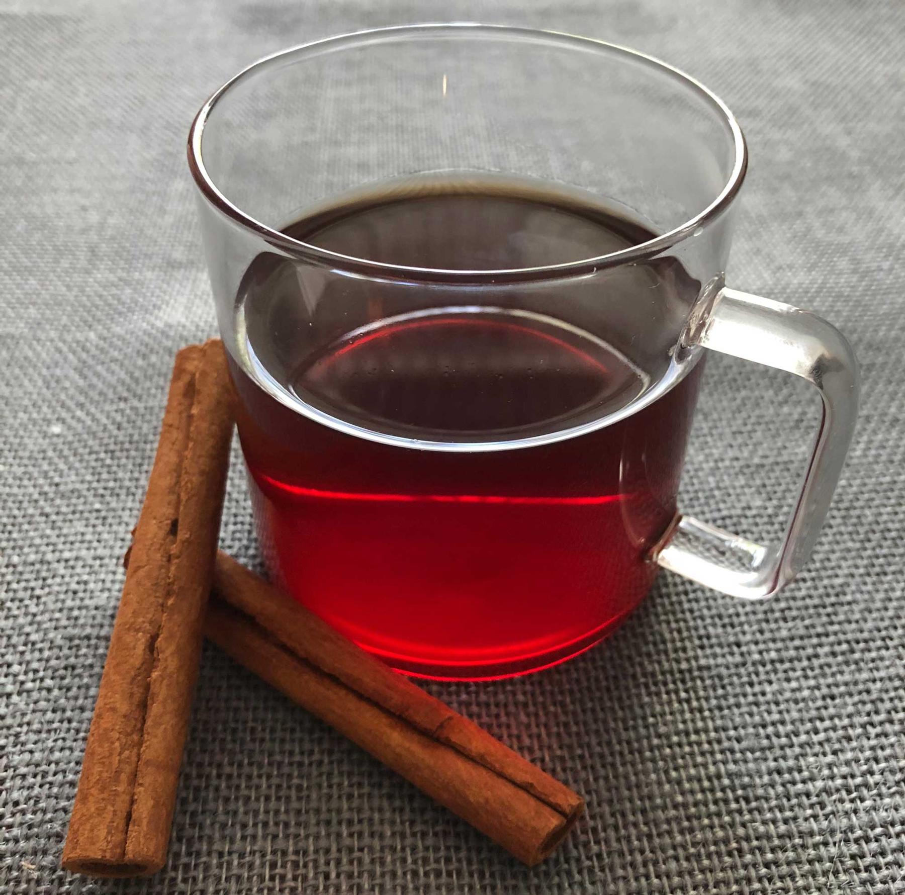 An example of the Simply Red, the mixed drink (drink) featuring rooibus (brewed), Averell Damson Plum Gin Liqueur, sugar, and cinnamon stick; photo by Lee Edwards