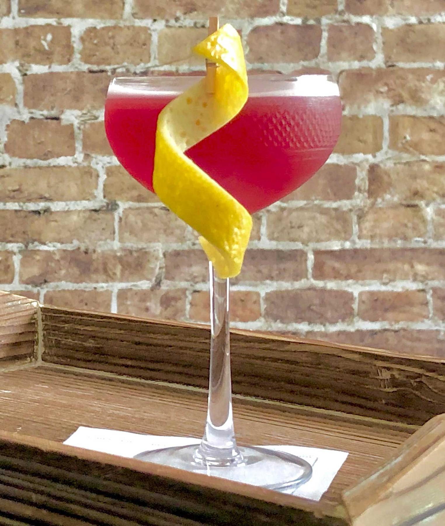 An example of the Jack the Elder, the mixed drink (drink) featuring apple brandy, lime juice, Rothman & Winter Orchard Elderberry Liqueur, rich simple syrup, and lemon twist; photo by Lee Edwards