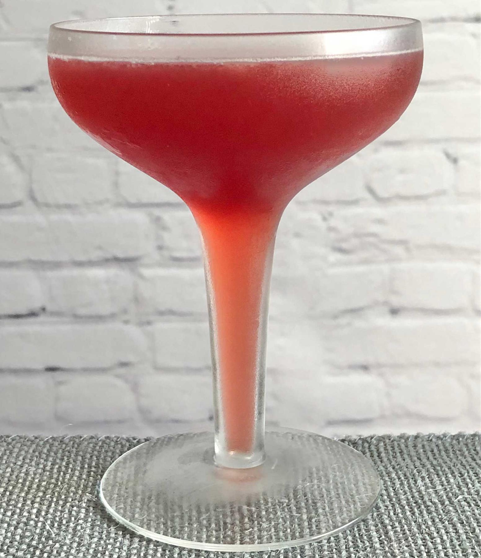 An example of the Robson Cocktail, the mixed drink (drink), by Savoy Cocktail Book, featuring Smith & Cross Traditional Jamaica Rum, grenadine, orange juice, lemon juice, and Angostura bitters; photo by Lee Edwards