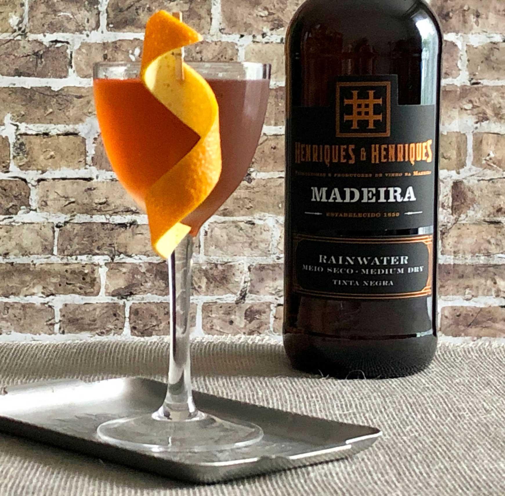 An example of the Union Cocktail, the mixed drink (drink), adapted from a recipe by Brother Cleve, Boston, MA, featuring irish whiskey, Henriques & Henriques Rainwater Madeira, Meletti, orange bitters, Angostura bitters, and orange twist; photo by Lee Edwards