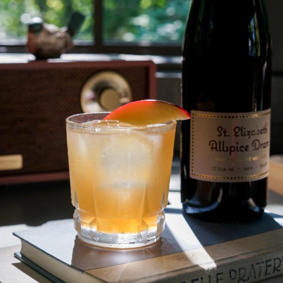 An example of the Cider Delighter, the mixed drink (drink), by Meaghan Dorman, NYC, featuring vodka, sweet cider, St. Elizabeth Allspice Dram, lemon juice, aromatic bitters, and apple slice; photo by Madison Young