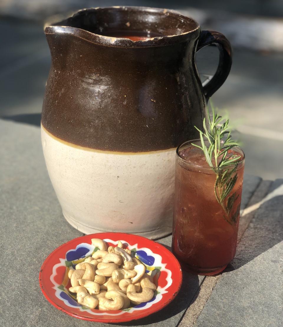 An example of the Scobey Doo, the mixed drink (drink) featuring kombucha, Averell Damson Plum Gin Liqueur, and sprig of rosemary; photo by Scott Krahn