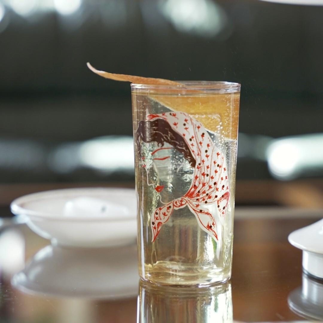 An example of the Salt of the Earth, the mixed drink (drink) featuring Fever Tree Indian Tonic Water, Amaro Alta Verde, Mattei Cap Corse Blanc Quinquina, salt, and grapefruit twist; photo by Madison Young