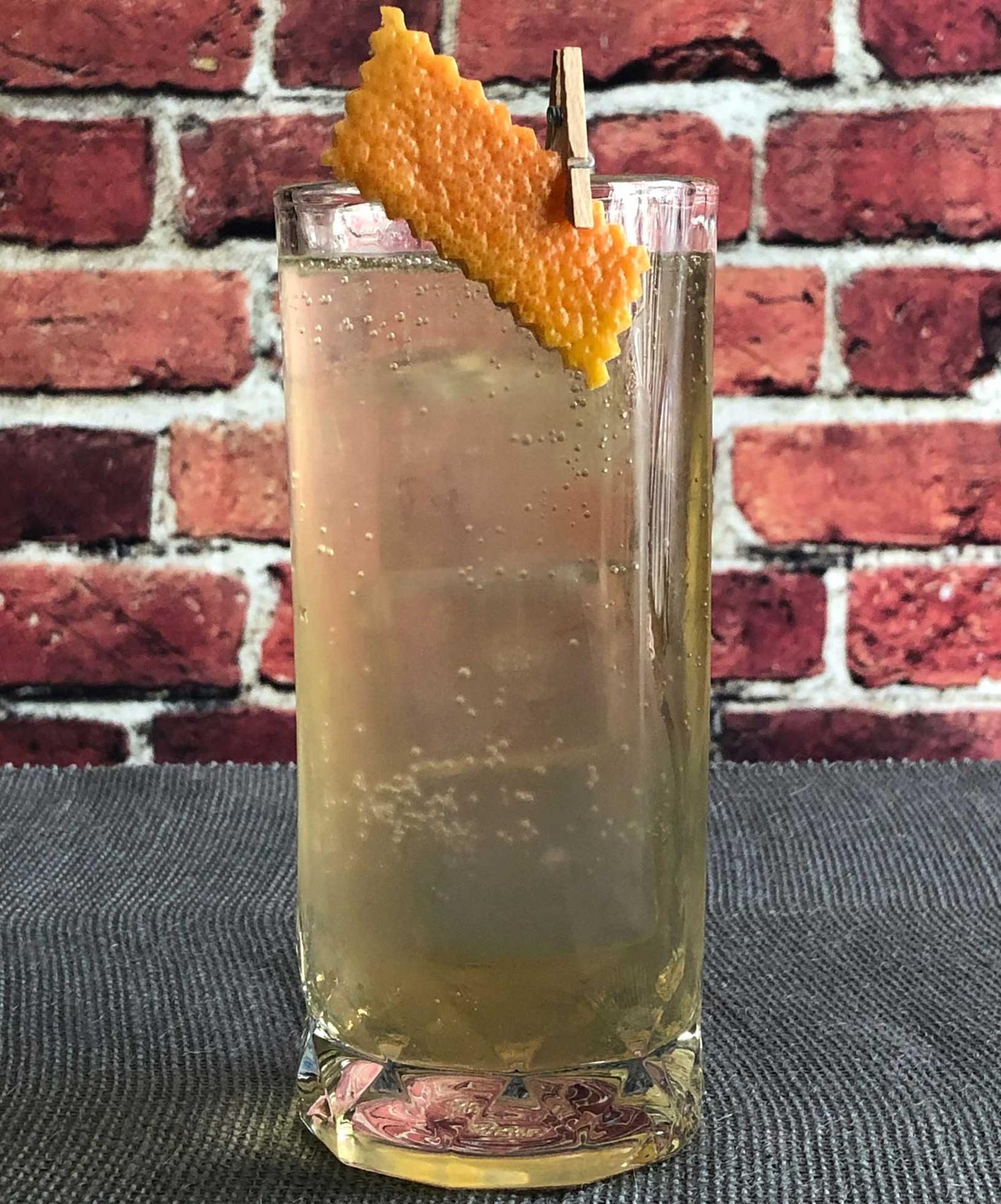 An example of the Salt of the Earth, the mixed drink (drink) featuring Fever Tree Indian Tonic Water, Amaro Alta Verde, Mattei Cap Corse Blanc Quinquina, salt, and grapefruit twist; photo by Lee Edwards