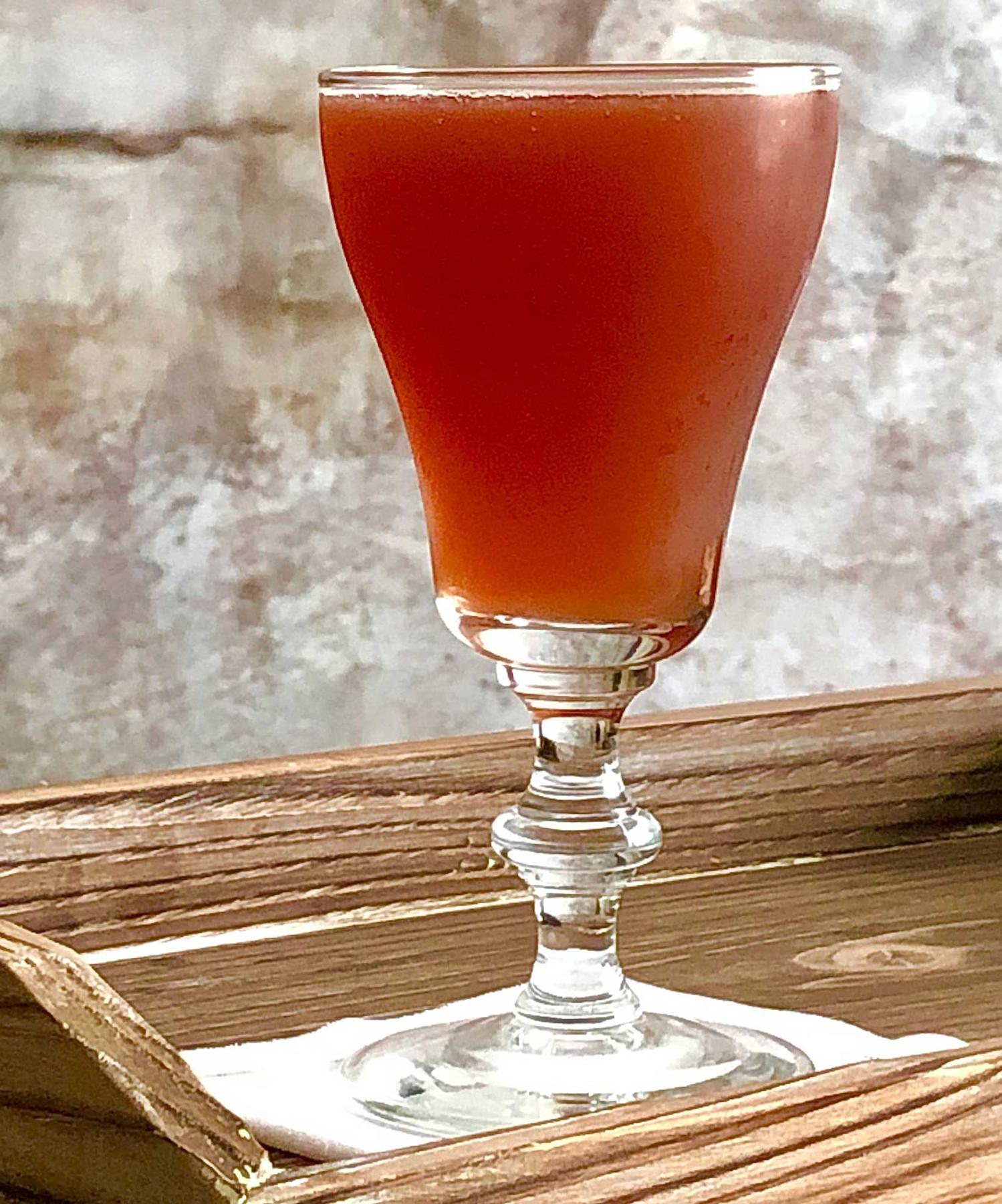 An example of the Plum Billet, the mixed drink (drink), variation on the Pruneaux cocktail, Savoy Cocktail Book, featuring Hayman’s Royal Dock Navy Strength Gin, Matifoc Rancio Sec, orange juice, Byrrh Grand Quinquina, simple syrup, and Angostura bitters; photo by Lee Edwards