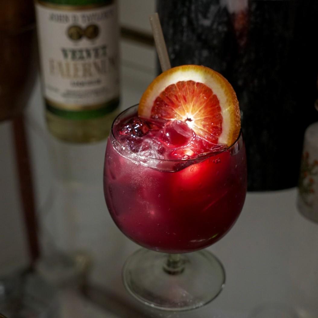 An example of the Sangria Base, the mixed drink (drink) featuring red wine, John D. Taylor’s Velvet Falernum, and orange juice; photo by Madison Young