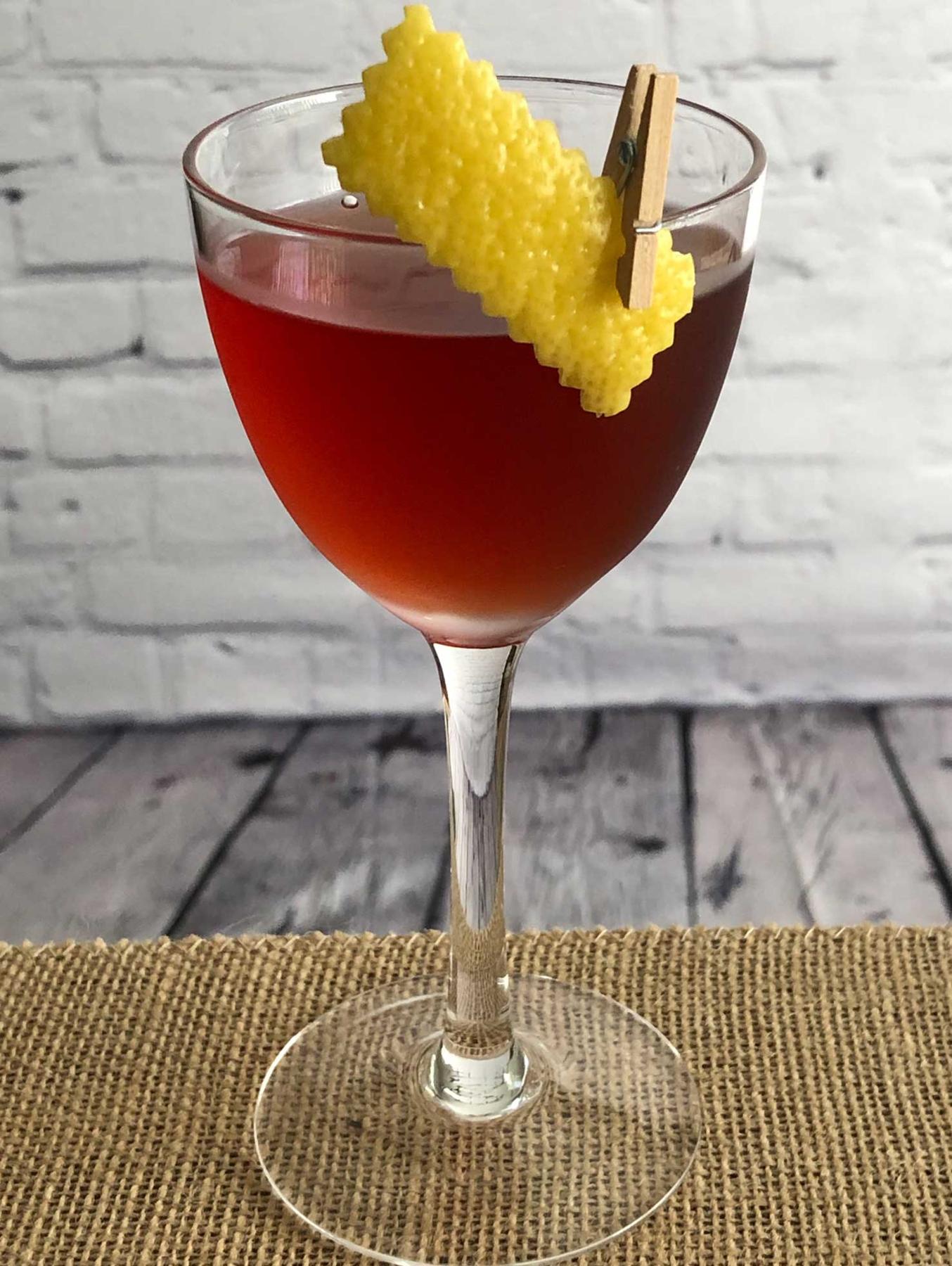 An example of the Cold Byrrrrh, the mixed drink (drink), by John Wabeck, Poulet Bleu and DeShantz, Pittsburgh, featuring Hayman’s London Dry Gin, Byrrh Grand Quinquina, orange bitters, and lemon twist; photo by Lee Edwards