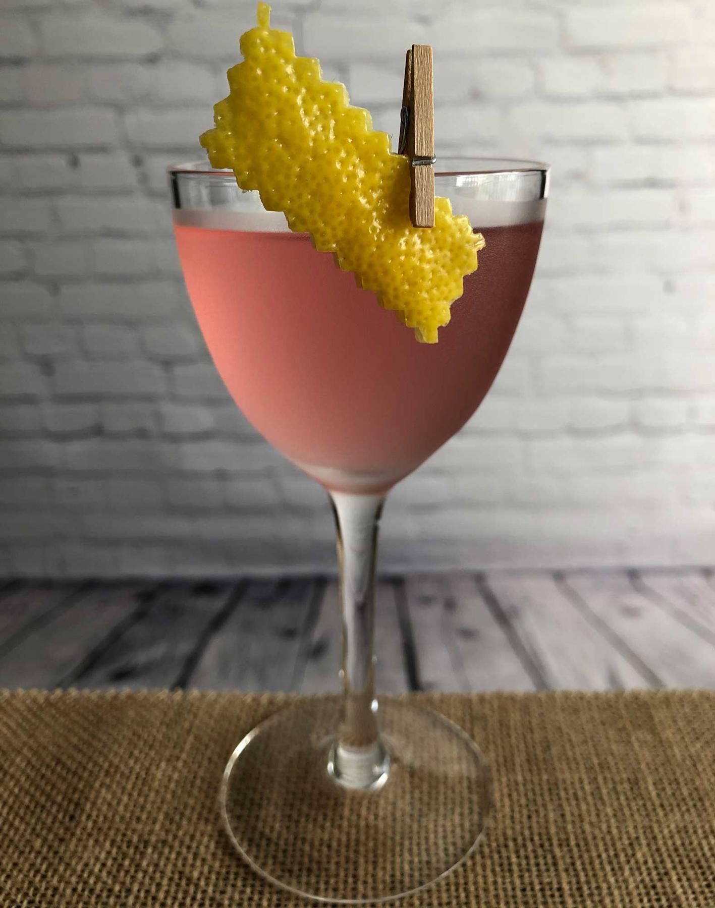 An example of the Atta Boy Cocktail, the mixed drink (drink), by Savoy Cocktail Book, featuring Hayman’s London Dry Gin, Dolin Dry Vermouth de Chambéry, grenadine, and lemon twist; photo by Lee Edwards