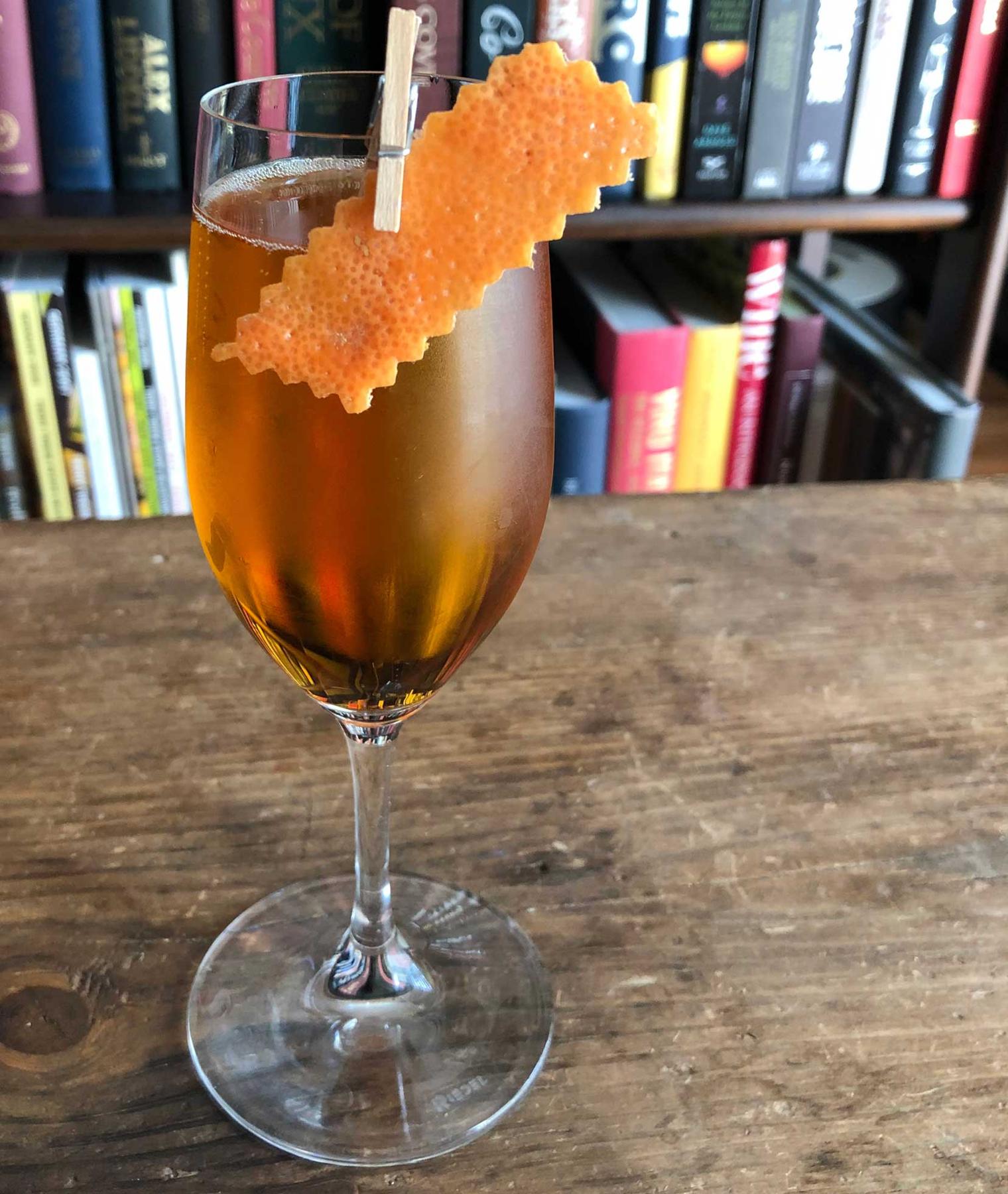 An example of the Champagne Supernova, the mixed drink (drink) featuring Cocchi Asti DOCG, Rothman & Winter Orchard Apricot Liqueur, Elisir Novasalus, and grapefruit twist; photo by Lee Edwards