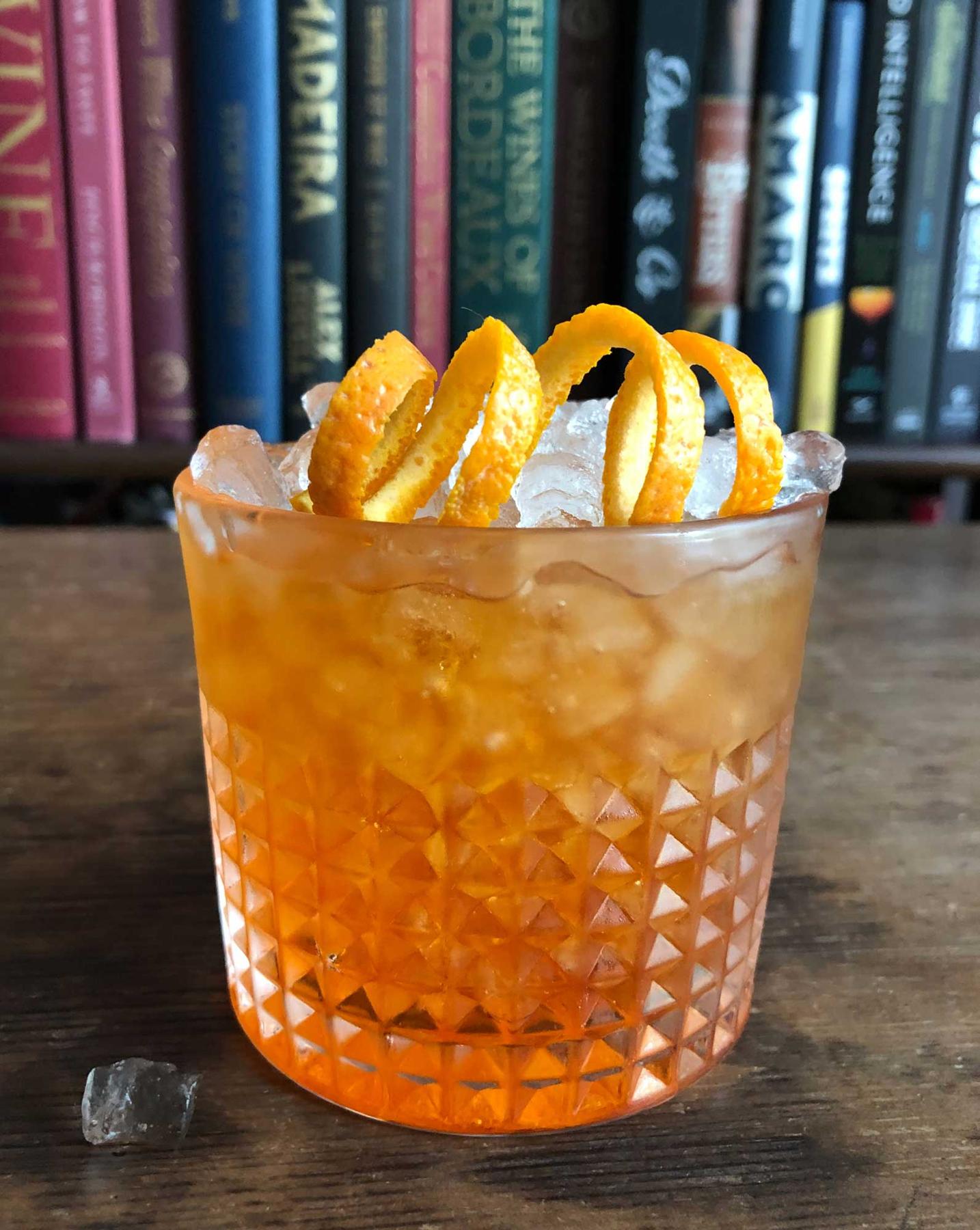 An example of the Negroni Sbagliato, the mixed drink (drink) featuring sparkling wine, Aperitivo Cappelletti, Cocchi Vermouth di Torino ‘Storico’, and orange twist; photo by Lee Edwards